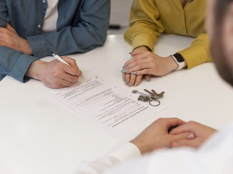 male-real-estate-agent-doing-business-showing-house-potential-buying-couple